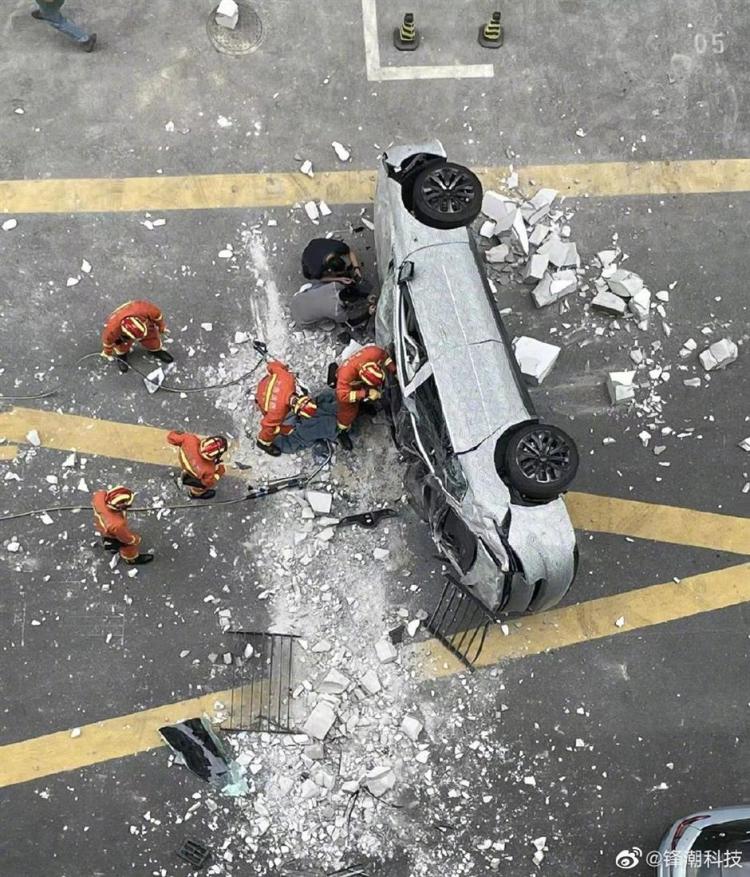 Firefighters trying to rescue victims from the crashed car