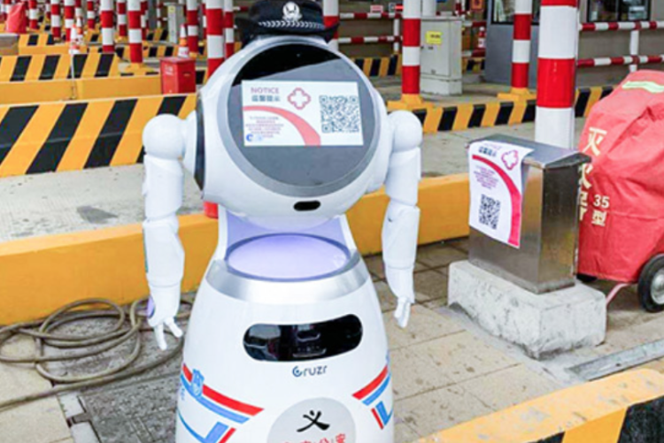 A robot automatically takes temperatures of drivers passing through a highway checkpoint.