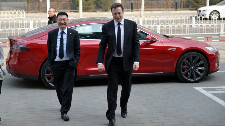 (Tom Zhu with Elon Musk; photo from Duke University's Fuqua School of Business)